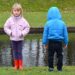 Girl looking forward. Boy looking backward. Opposites.